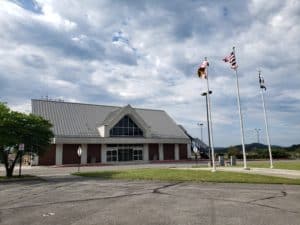 Airport building and flagpoles at Greater Cumberland Regional Airport